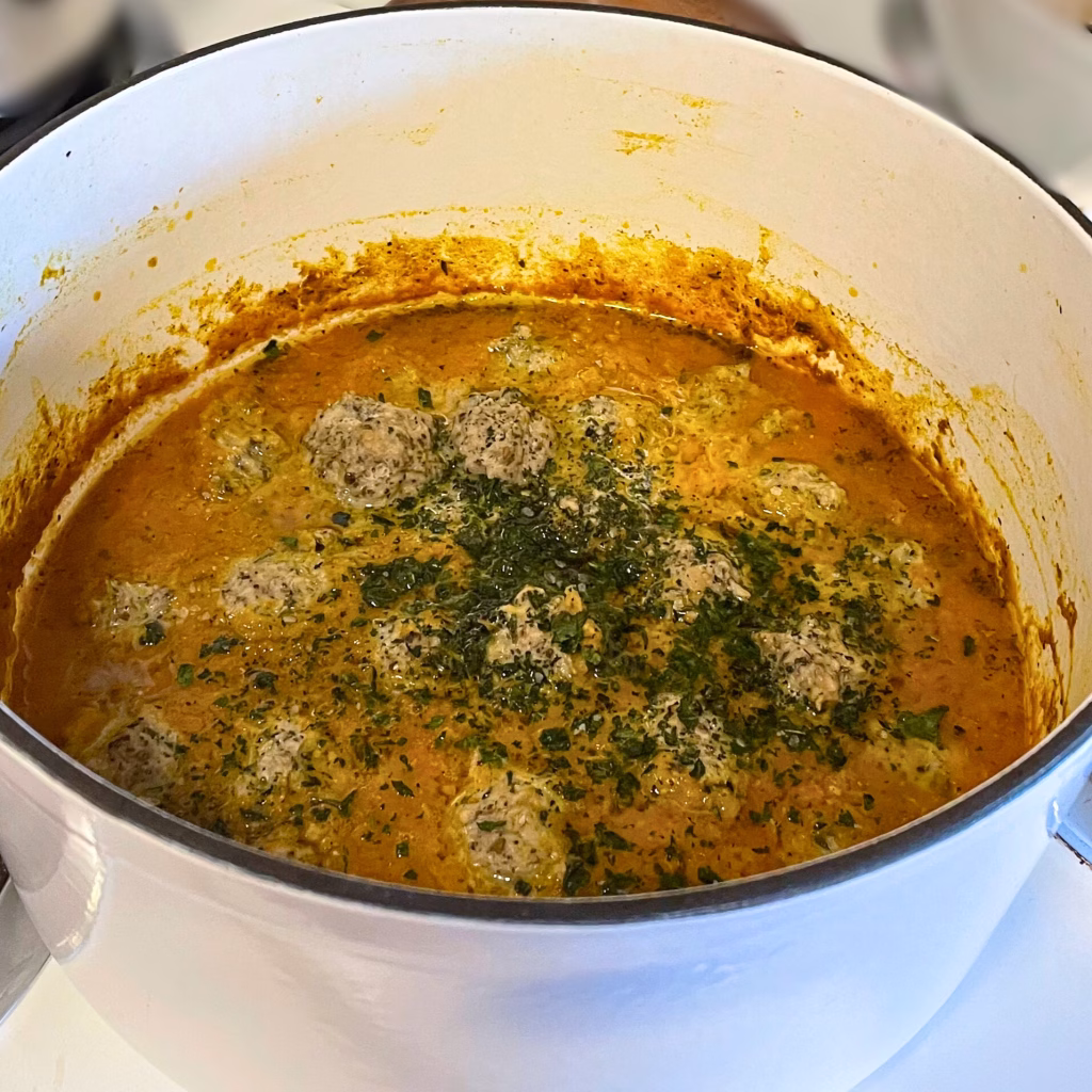 A pot of AIP-friendly no-mato sauce with turkey meatballs